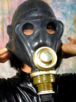 Girl posing with gas mask